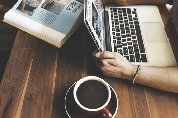 Looking at website over laptop