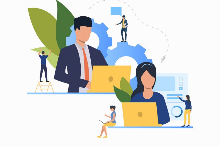 Two people at laptops