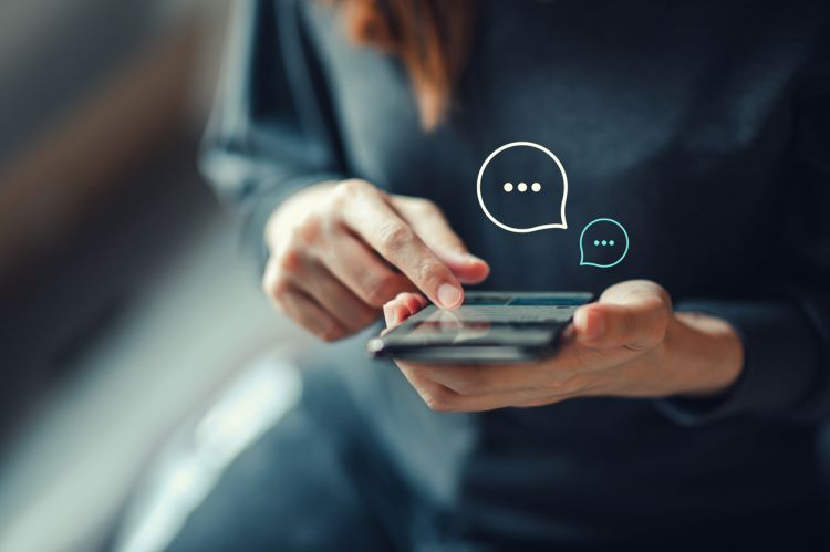 person using live chat on mobile device
