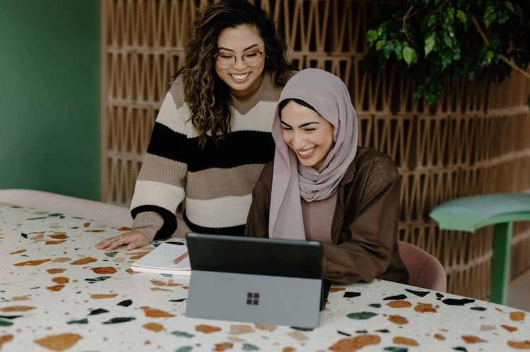 women working on a computer