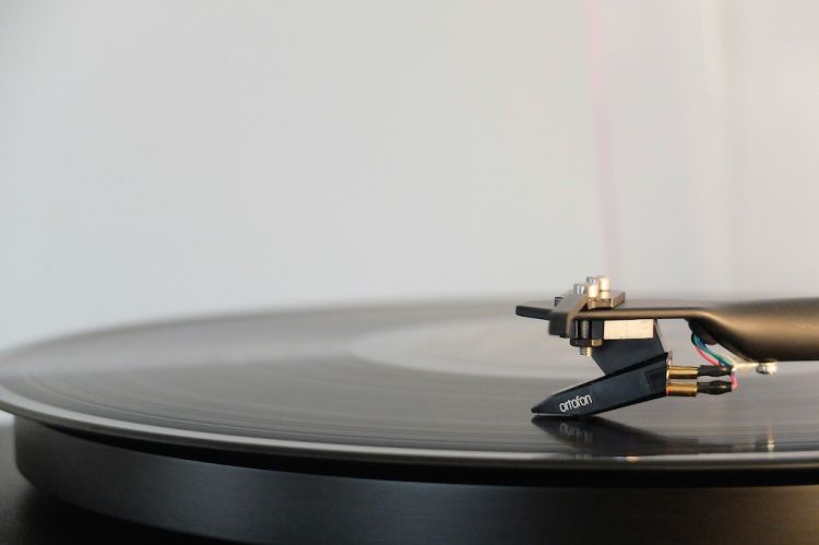 a vinyl disc on a record player