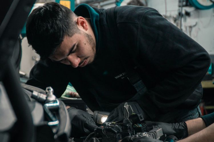 a mechanic working on a car