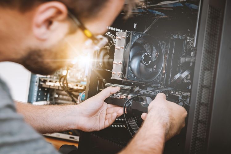 Man working on electronics repair