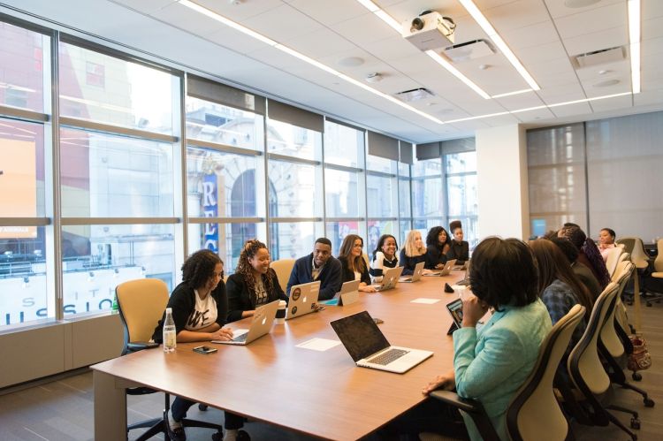 A group of businesspeople sitting at a conference table.