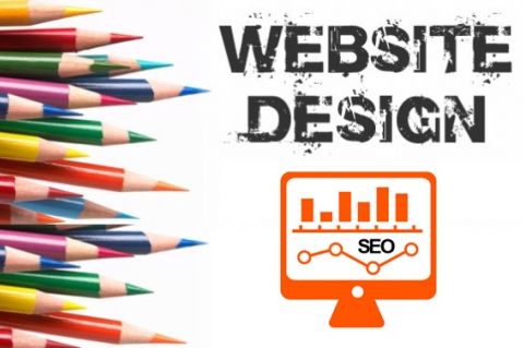 Website Design with pencils near monitor