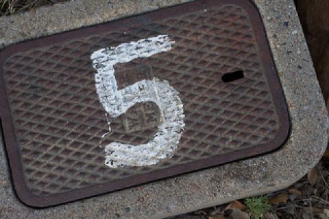Number five painted on grate