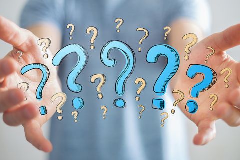 Hands spread wide with question marks between hands.  Image provided by Author.