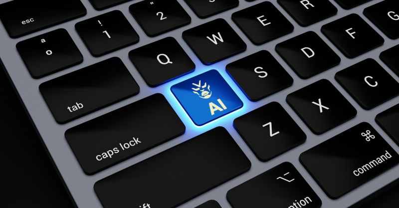 Closeup on a keyboard with an 'AI' key lit up blue