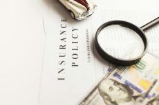 Closeup of a paper with the headline "Insurance Policy"