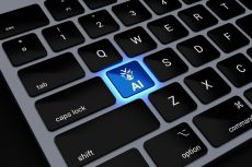 Closeup on a keyboard with an 'AI' key lit up blue