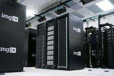 Rows of black server racks with white logos in a data center
